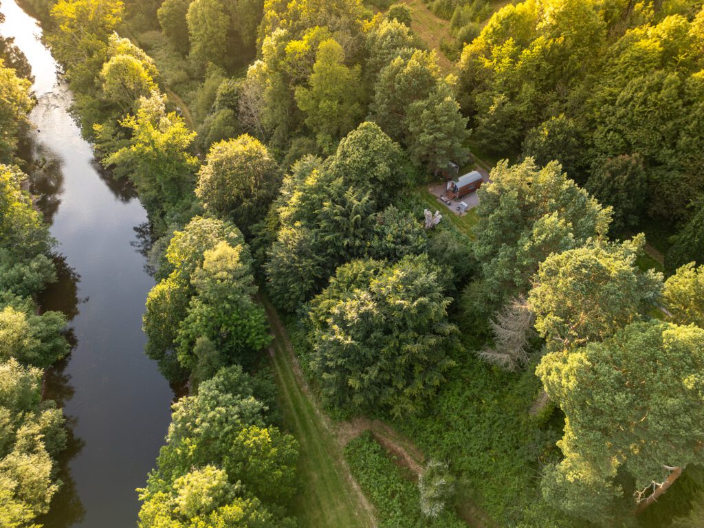 ariel of the oak retreat next to the river